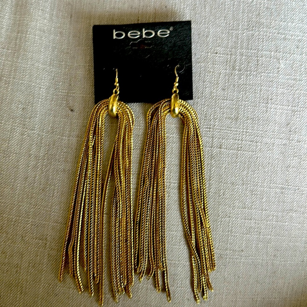 Gold never worn BEBE earrings. New with tags